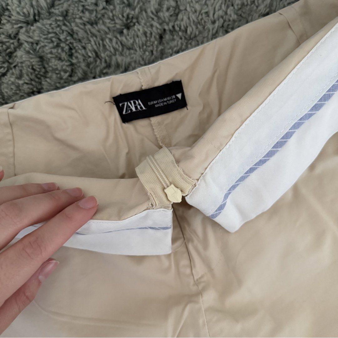 authentic zara beige with pinstripe skort (Category: Skirts) located in Cebu City. Submitted by sayonarasells (Listing ID 1468313531, Image 2). Description: - Authentic Zara beige skort - Features a stylish folded white and blue pinstripe waistband - Size: Medium (EUR M / US M / fits 26-28 waist) - Condition: Pre-loved, well-maintained - Perfect for smart-casual outfits and everyday wear.