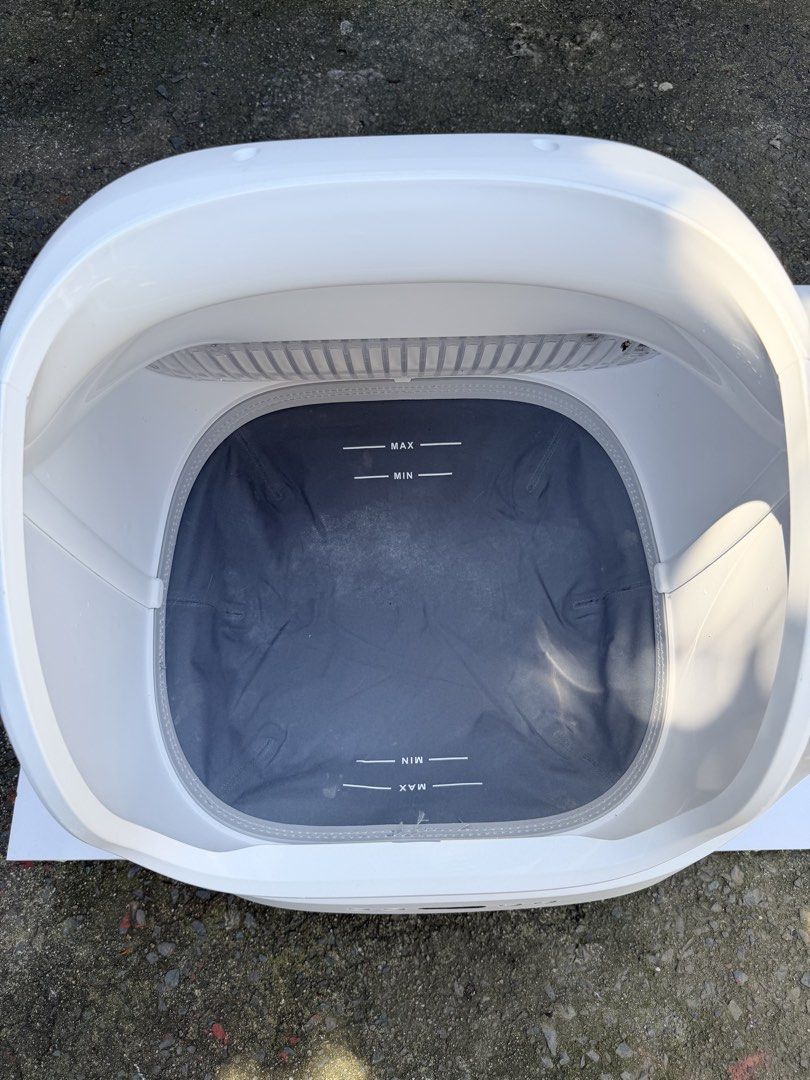 Automatic Smart Cat Litter Box Self-Cleaning (Category: Health & Grooming) located in Quezon City. Submitted by onlynina222 (Listing ID 1468341144, Image 3). Description: - Color: Clean white with stylish wooden legs - Design: Modern minimal look with a front control panel and easy-to-use power buttons - Interior: Gray inner lining with clear MIN and MAX fill level markers - Functionality: Built-in sifter grill for automatic waste management - Pe