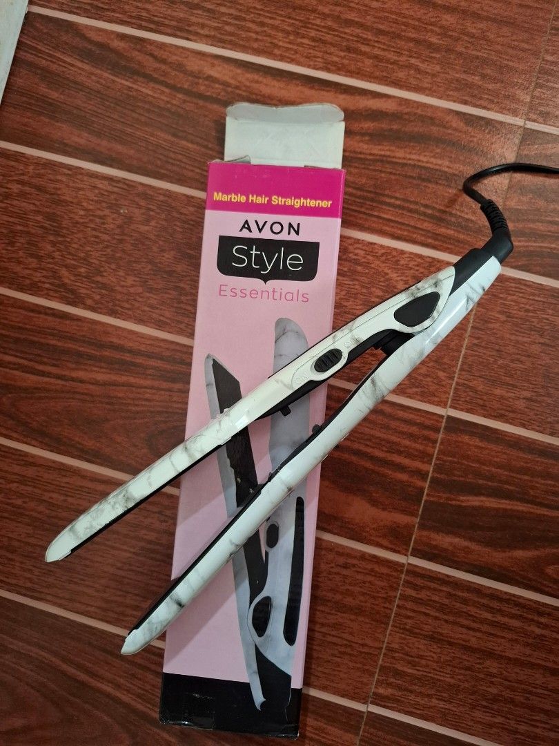 AVON Style Essentials Marble Hair Straightener (Category: Hair) located in Cavite. Submitted by sheeeki_ (Listing ID 1468308769, Image 1). Description: - Brand: AVON Style Essentials - Design: Trendy white marble finish - Fast Heating: Heats up in just 2 minutes - Easy to Use: Simple on/off switch on the side with safety lock - Comes with original pink box and instruction manual at the back - Ideal For: Convenient home styling - Used only once fo