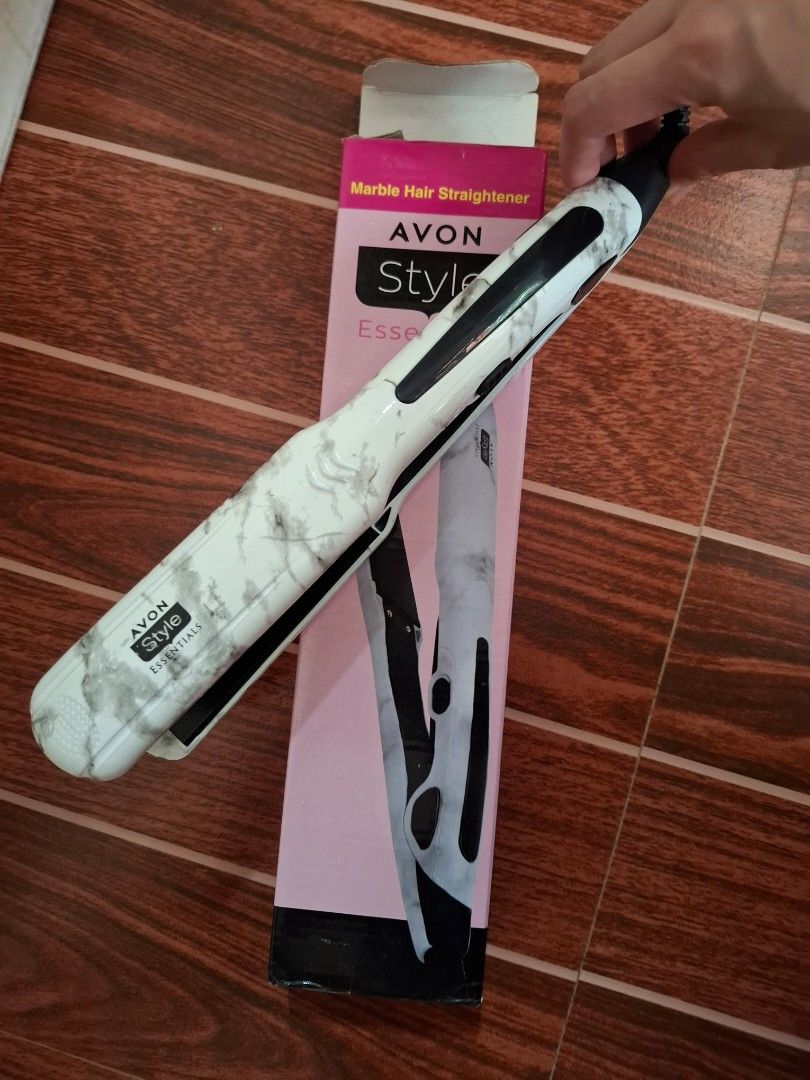 AVON Style Essentials Marble Hair Straightener (Category: Hair) located in Cavite. Submitted by sheeeki_ (Listing ID 1468308769, Image 2). Description: - Brand: AVON Style Essentials - Design: Trendy white marble finish - Fast Heating: Heats up in just 2 minutes - Easy to Use: Simple on/off switch on the side with safety lock - Comes with original pink box and instruction manual at the back - Ideal For: Convenient home styling - Used only once fo