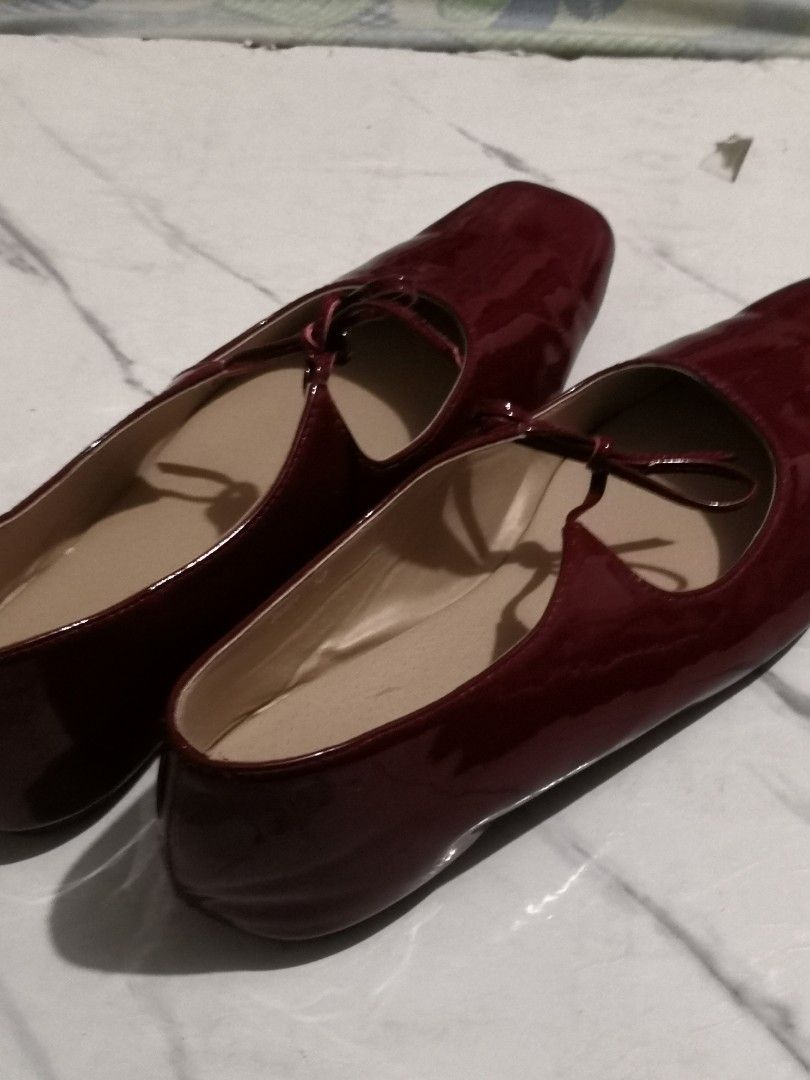 Aztrid Gigi in Burgundy (Category: Flats & Sandals) located in Manila. Submitted by ilovestrawberriesomuch (Listing ID 1468367752, Image 1). Description: - Model: Aztrid Flats - Color/Finish: Deep Maroon Patent (shiny exterior) - Design: Square toe with a dainty front tie bow strap - Interior: Neutral beige lining with branded insoles - Fit: Comfortable slip-on style - Versatility: Great for daily wear or dressing up any outfit rfs: i bought it a