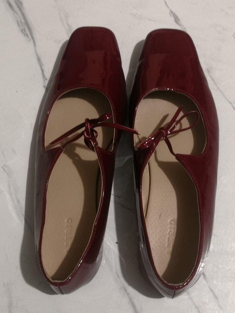 Aztrid Gigi in Burgundy (Category: Flats & Sandals) located in Manila. Submitted by ilovestrawberriesomuch (Listing ID 1468367752, Image 2). Description: - Model: Aztrid Flats - Color/Finish: Deep Maroon Patent (shiny exterior) - Design: Square toe with a dainty front tie bow strap - Interior: Neutral beige lining with branded insoles - Fit: Comfortable slip-on style - Versatility: Great for daily wear or dressing up any outfit rfs: i bought it a