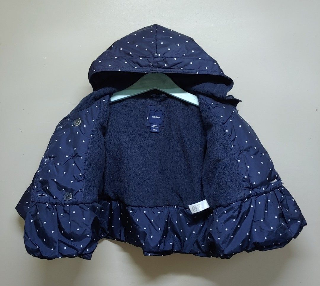 Baby Gap Puffer Jacket 18-24 Months (Category: Babies & Kids Fashion) located in Dagupan City. Submitted by upforgrabs2400 (Listing ID 1468430668, Image 3). Description: Baby Gap Puffer Jacket - Size: 18-24 months - Measurements: Shoulders 11" | Chest 14" | Length 14" - Color/Pattern: Navy blue with white polka dots - Features: Cozy attached hood, warm fleece lining, and double-breasted button closure.