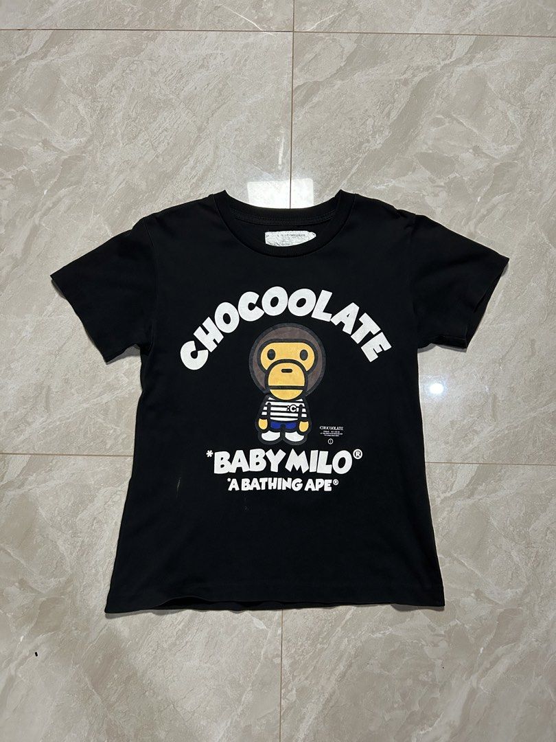 Baby Milo x Chocoolate Black Tee (Category: Shirts) located in Tayabas. Submitted by streetdepartment (Listing ID 1468415320, Image 1). Description: Baby Milo x Chocoolate Black Tee Good condition Color rate 8/10 Issue: washable stain and holr Size: Small fits XS Womens Measurements (inches): Width: 16” Length: 21.5” Dm to purchase! Note: Manage your expectations as you are dealing with secondhand items. Color may vary due to lighting. No return 