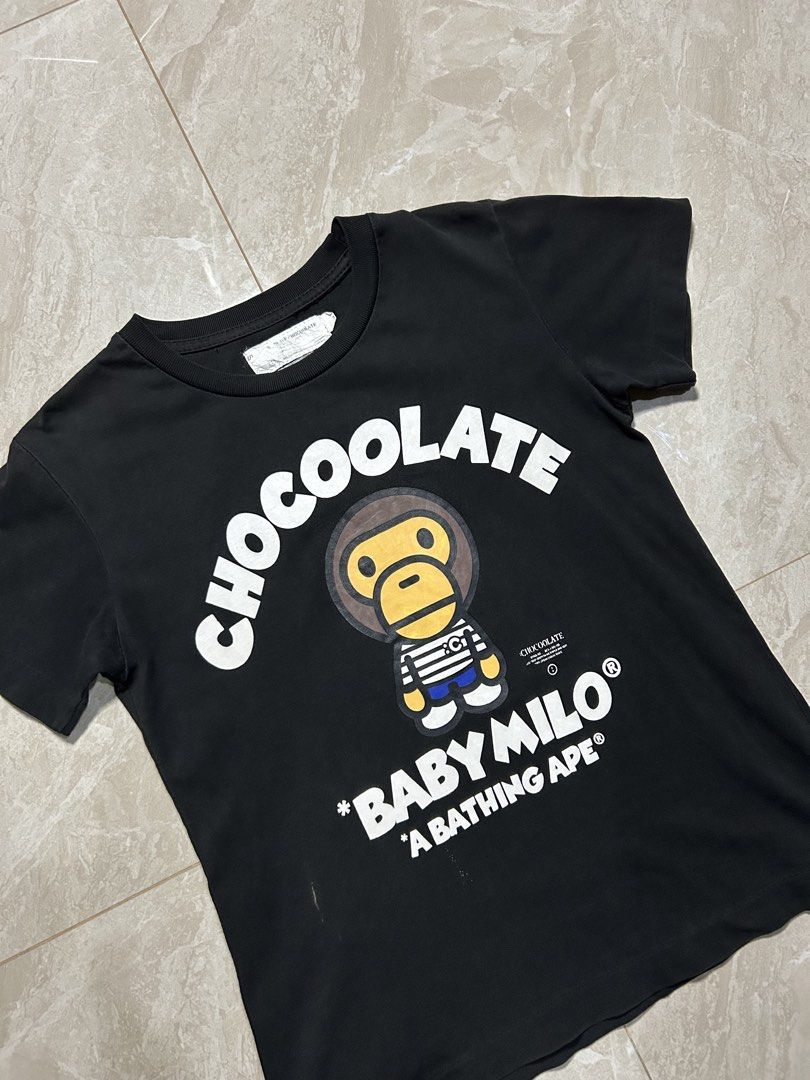Baby Milo x Chocoolate Black Tee (Category: Shirts) located in Tayabas. Submitted by streetdepartment (Listing ID 1468415320, Image 3). Description: Baby Milo x Chocoolate Black Tee Good condition Color rate 8/10 Issue: washable stain and holr Size: Small fits XS Womens Measurements (inches): Width: 16” Length: 21.5” Dm to purchase! Note: Manage your expectations as you are dealing with secondhand items. Color may vary due to lighting. No return 