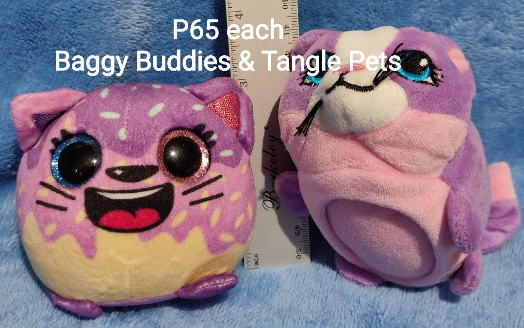 Baggy Buddies & Tangle Pets Plush Toys (Category: Plushies & Soft Toys) located in Baguio. Submitted by abigailmyra (Listing ID 1468335273, Image 2). Description: - Authentic Baggy Buddies and Tangle Pets:Cupcake the Cat plush toys - Vibrant purple, pink, and multi-colored designs - Original tags still attached on the back -P65 each loc:Baguio-CAR.