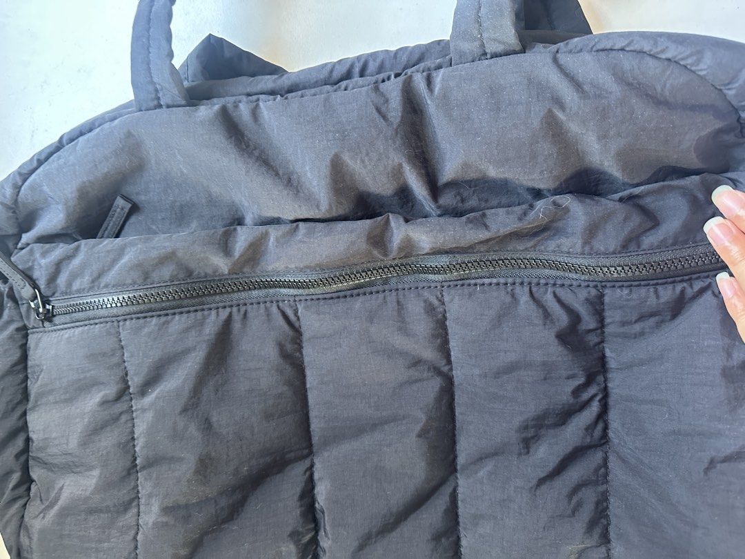BAGSMART Black duffle bag PLUS (Category: Tote Bags) located in Paranaque City. Submitted by kimdmd (Listing ID 1468325898, Image 3). Description: - Brand: BAGSMART - Color: Classic black with grey interior lining - Material: Trendy quilted puffer design - Storage: Spacious main compartment with top zip closure - Extra Pockets: Front zipped pocket and interior slip pockets - Laptop Compartment: Dedicated padded sleeve with elastic security strap 