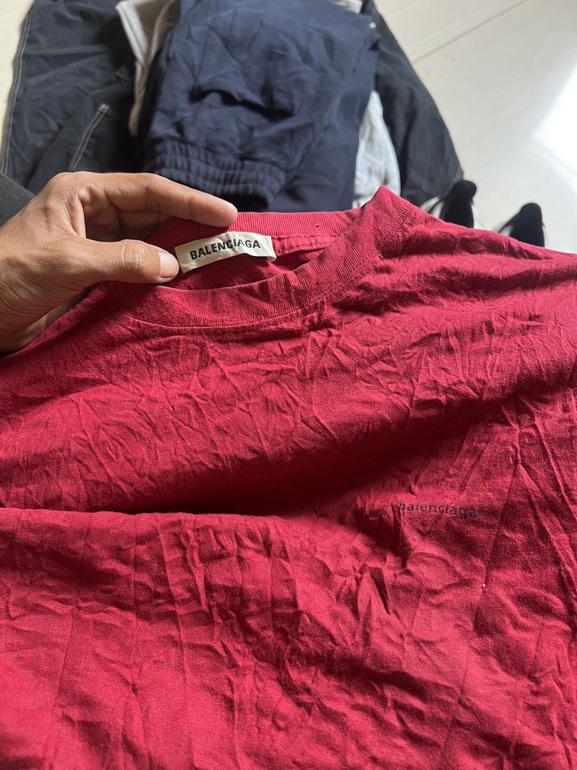 Balenciaga Red T-Shirt Medium (Category: Shirts) located in Zamboanga. Submitted by safe.haimer (Listing ID 1468446564, Image 3). Description: - Brand: Balenciaga - dimes L28 W23 - Size: Medium (tag at collar) - Material: Cotton (Made in Portugal) - Design: Crew neck with small black logo embroidery on the chest - Condition: Good, with normal signs of wear - Details: Interior care label intact.