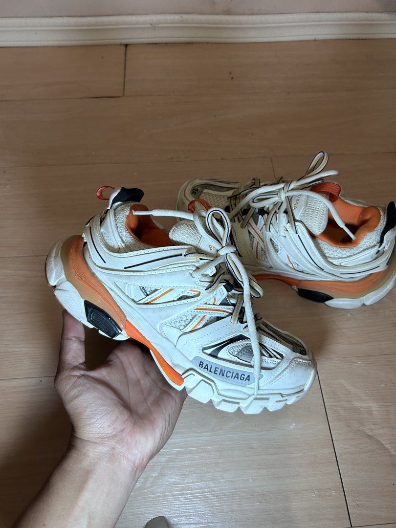 Balenciaga Track Sneaker White Orange Size 35 (Category: Sneakers) located in Dipolog. Submitted by adrian281994 (Listing ID 1468411096, Image 1). Description: - Brand: Balenciaga Track Sneakers - Colorway: White and Orange with matching inner lining and heel loop - Size: 35 (marked on toe and tongue pull tab) - Design: Chunky multi-panel layered mesh and nylon upper - Sole: Complex rubber sole with trendy distressed detailing - Details: Signatur