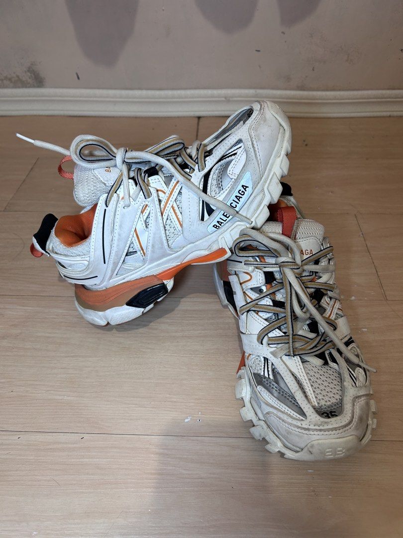 Balenciaga Track Sneaker White Orange Size 35 (Category: Sneakers) located in Dipolog. Submitted by adrian281994 (Listing ID 1468411096, Image 2). Description: - Brand: Balenciaga Track Sneakers - Colorway: White and Orange with matching inner lining and heel loop - Size: 35 (marked on toe and tongue pull tab) - Design: Chunky multi-panel layered mesh and nylon upper - Sole: Complex rubber sole with trendy distressed detailing - Details: Signatur