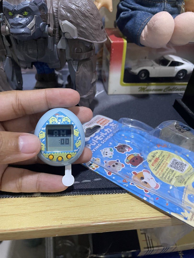 Bandai Pui Pui Molcar & TinyTAN Tamagotchi Bundle (Category: Interactive Toys) located in Agdangan. Submitted by kuradekawaii_06 (Listing ID 1468400703, Image 2). Description: - Set of 2 authentic Bandai Tamagotchi virtual pets - Variants: Pui Pui Molcar Driving School Ver. (Blue) and TinyTAN Purple Ver. - Condition: Like new, taken out of packaging for photos only - Screen tested: Battery tabs pulled to test screens, original pull tabs included 