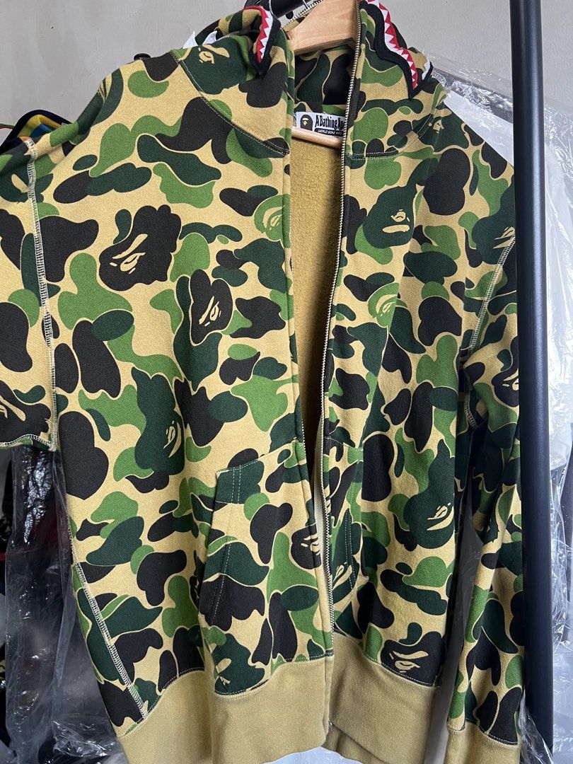 Bape camp full zip hoodie (Category: Hoodies) located in Cavite. Submitted by ziicollections (Listing ID 1468302747, Image 1). Description: Selling My personal hoodie Abc camo green full zip hoodie Womens sizing on tag MEDIUM: 22 width x 25 length Japan released No issue or flaws.