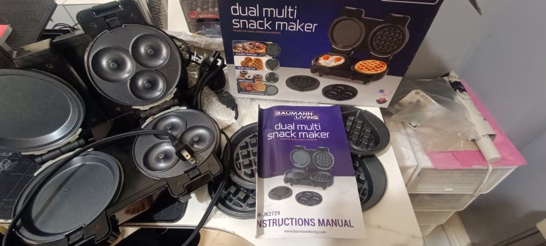Baumann Living Dual Multi Snack Maker (Category: Cookware & Accessories) located in Las Pinas. Submitted by andielle_0121 (Listing ID 1468346718, Image 1). Description: - Brand: Baumann Living Dual Multi Snack Maker Original Price: 3,500 (check orange app) negotiable po ang 2500 if sure buyer i can lessen it to 2k na lang po - Color: Sleek Black - Features: Dual cooking slots with interchangeable plates for waffles, donuts, pancakes, and eggs - C