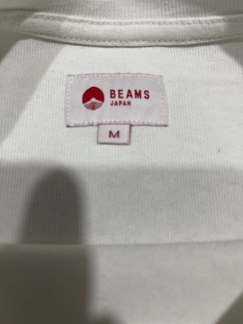 Beams Crewneck Tshirt (Category: Coats, Jackets and Outerwear) located in Mandaue City. Submitted by MJ_80 (Listing ID 1468370068, Image 2). Description: Beams Crewneck Tshirt Medium Dimes: 21.5 X 28 See photos for measurements Issue: may light yellow dot stain on sleeve. See last 2 photos & also front beside beam print Colo rate & Condition: 9.8/10 Price: 1,650 .