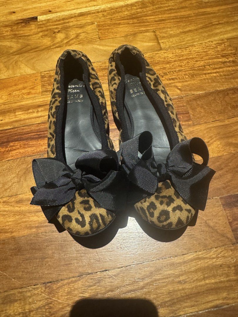 BEAMS Leopard Print Bow Ballet Flats Size 25 (Category: Flats & Sandals) located in Makati City. Submitted by raremixed (Listing ID 1468407416, Image 3). Description: - Brand: BEAMS - Style: Leopard print ballet flats with large black ribbon - Origin: Made in Japan - Size: 25 - Design: Slip-on with comfortable sole - Condition: Clean interior lining with printed branding; light wear on bottom soles.