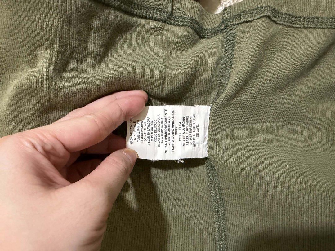 Bebe Olive Green Ribbed Zip-Up Jacket (Category: Coats, Jackets and Outerwear) located in Davao. Submitted by arbeepogio63169 (Listing ID 1468328236, Image 3). Description: - Brand: Bebe - Size: S (Made in U.S.A.) - Color: Olive green - Style: Fitted ribbed zip-up jacket with mock neck - Details: Signature rhinestone logo on left chest, branded metal zipper pull, and two front waist pockets - Condition: Excellent/Ready to wear.