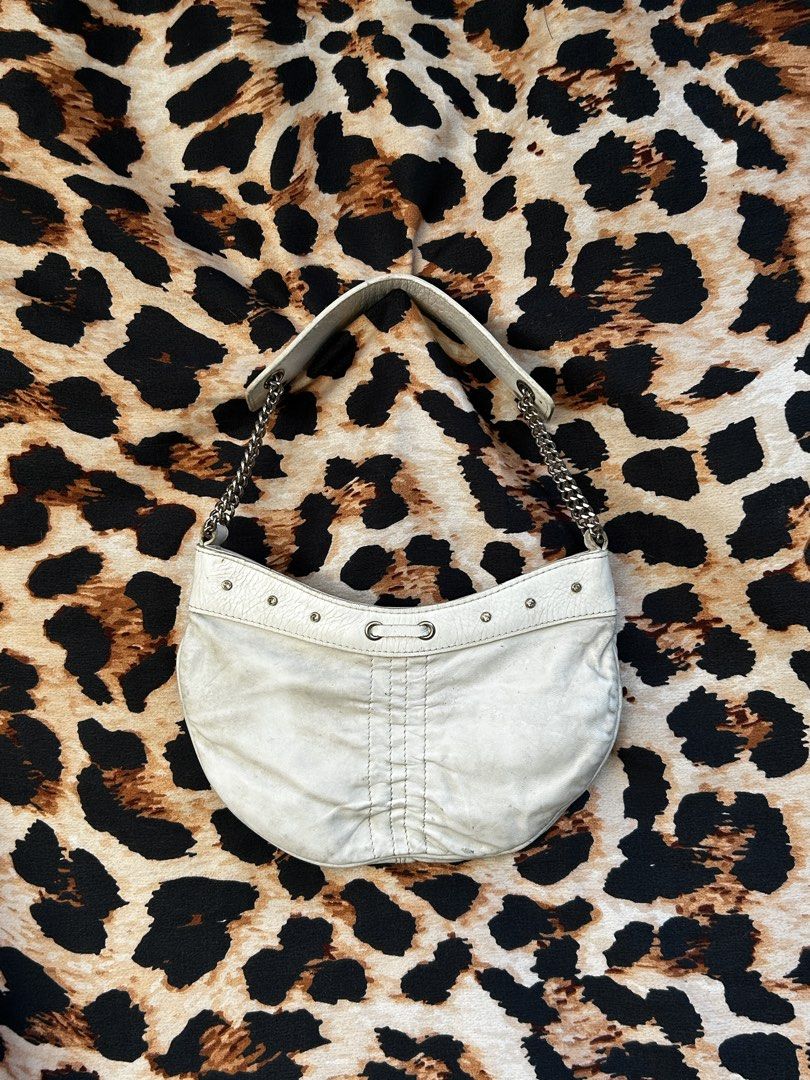 bebe White Leather Shoulder Bag with Chain Strap (Category: Shoulder Bags) located in Los Banos. Submitted by samsukehiro (Listing ID 1468382813, Image 1). Description: - Brand: bebe - Color: White leather with bright hot pink lining - Hardware: Silver-tone throughout - Straps: Stylish silver chain straps - Details: Front stud accents and cute ruched center on lower front - Interior: Includes convenient zipper pockets - Condition: Excellent pre-l