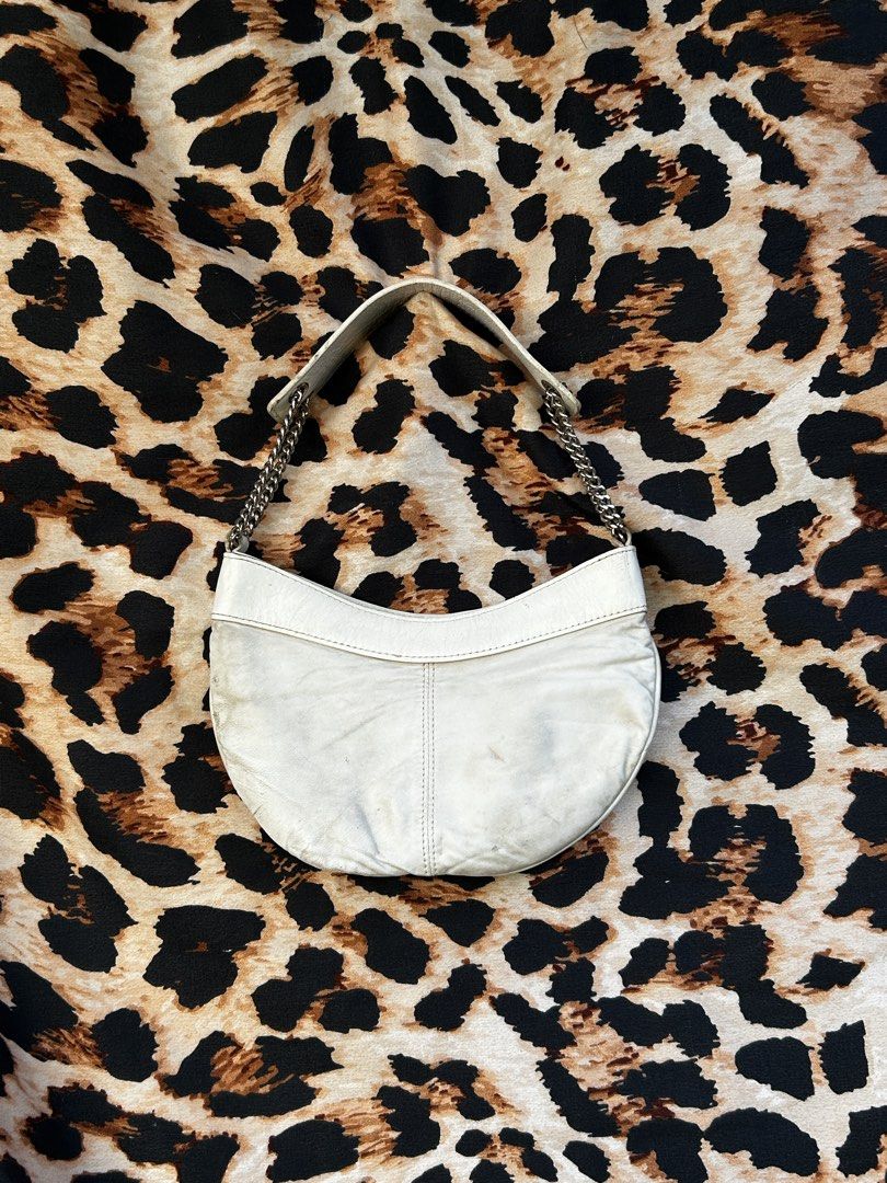 bebe White Leather Shoulder Bag with Chain Strap (Category: Shoulder Bags) located in Los Banos. Submitted by samsukehiro (Listing ID 1468382813, Image 2). Description: - Brand: bebe - Color: White leather with bright hot pink lining - Hardware: Silver-tone throughout - Straps: Stylish silver chain straps - Details: Front stud accents and cute ruched center on lower front - Interior: Includes convenient zipper pockets - Condition: Excellent pre-l