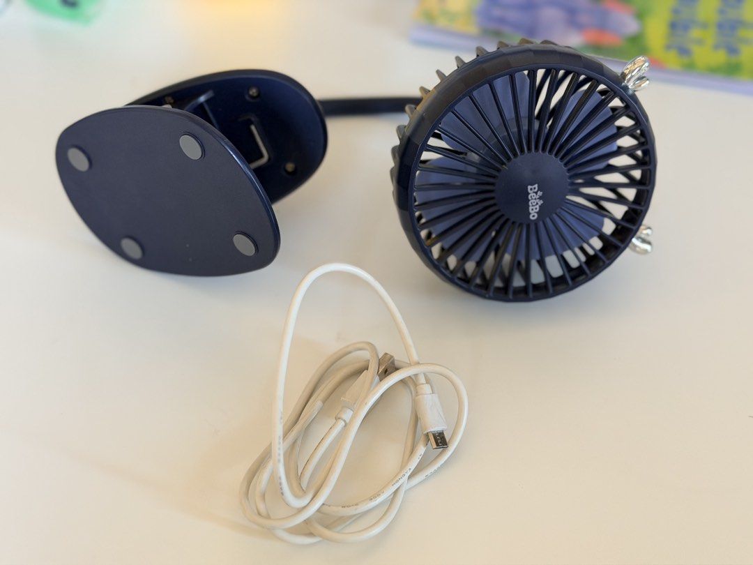 BeeBo Dark Blue Clip-On Fan (Category: Other Kids Furniture) located in Paranaque City. Submitted by sweetiesarah01 (Listing ID 1468355221, Image 3). Description: - Brand: BeeBo - Color: Dark blue - Type: Clip-on fan with flexible gooseneck stem - Power: USB charging cable included - Features: Sturdy base clip for desks/shelves, simple back control buttons for power and speed - Condition: Tested and works well - Ideal for: Baby Stroller or Car Se