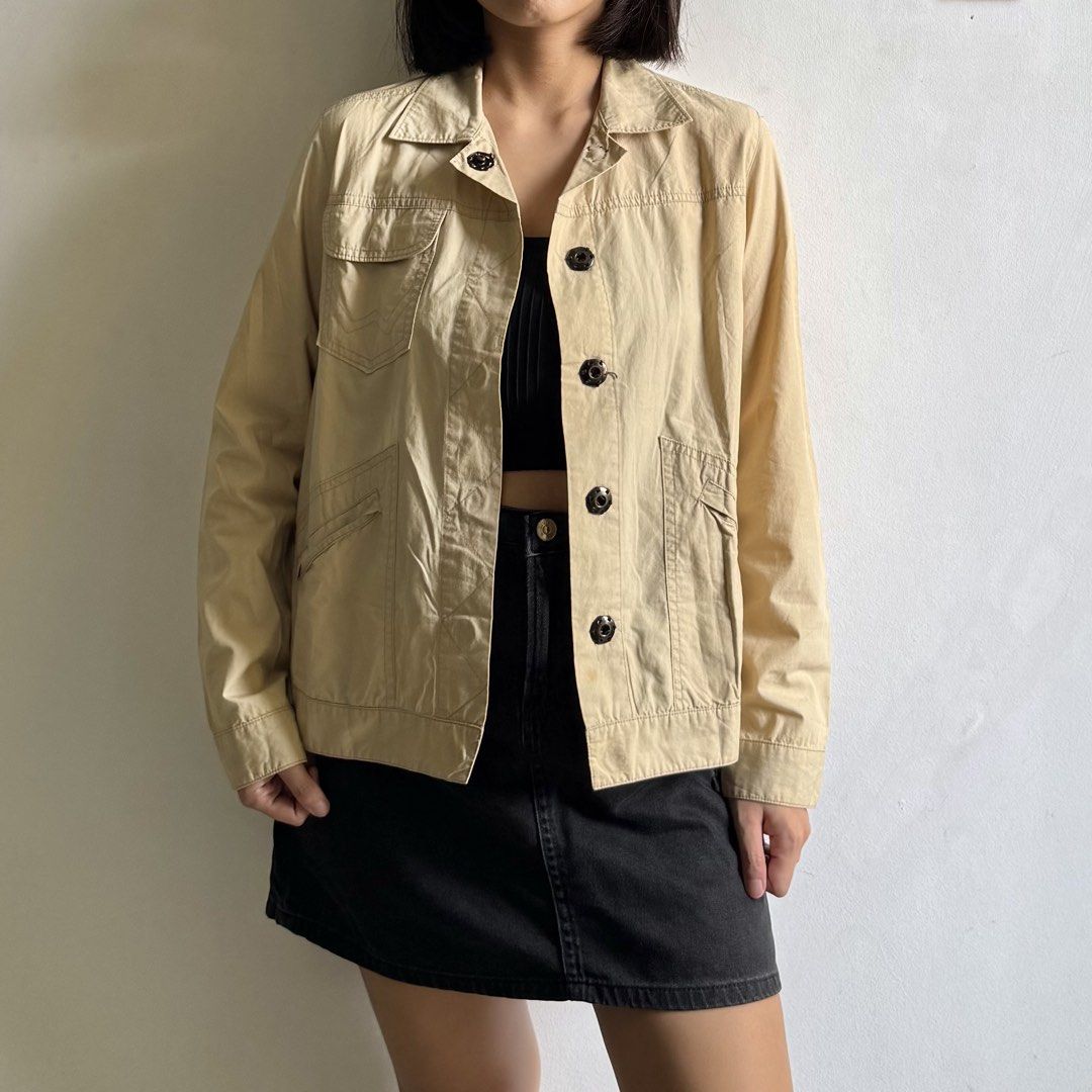 Beige Parka Jacket with Pockets (Category: Coats, Jackets and Outerwear) located in Bulacan. Submitted by _arislmt (Listing ID 1468499485, Image 1). Description: - Color: Beige - Style: Utility jacket / Transitional outerwear - Fabric: Structured cotton blend - Features: Multiple front pockets, dark buttons, classic collar, long sleeves - Fit: Comfortable for layering over crop tops and tees - Condition: Great for everyday casual outfits.