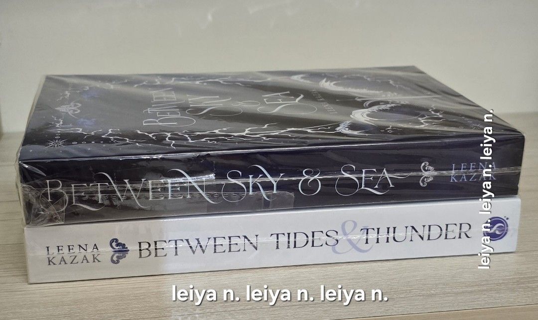 Between Sky & Sea and Between Tides & Thunder Books (Category: Storybooks) located in Manila. Submitted by leiya_lyn (Listing ID 1468358779, Image 1). Description: - Author: Leena Kazak - Set includes 2 books: 'Between Sky and Sea' & 'Between Tides and Thunder' - Condition: Brand new, sealed tightly in clear plastic - Covers: Dark illustrated (Sky/Sea) and White (Tides/Thunder) - Ships securely from a trusted Carousell seller!.