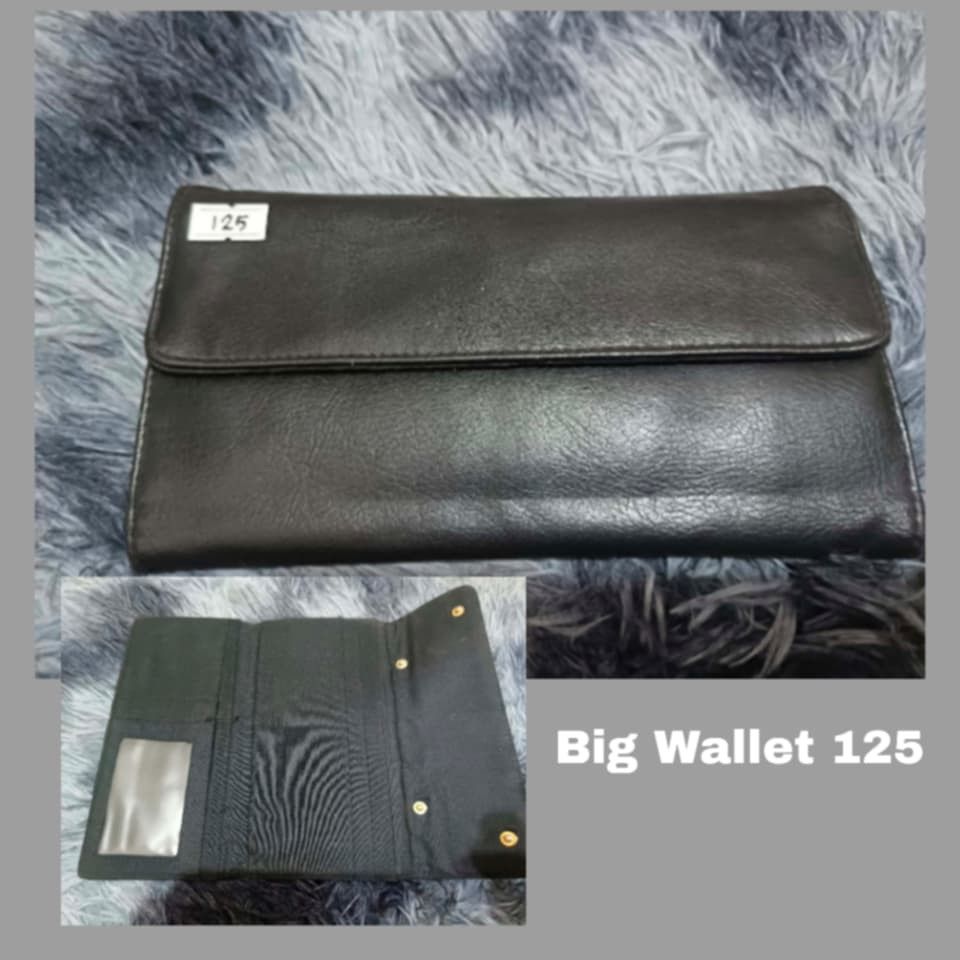Big Black Wallet 125 (Category: Wallets & Card holders) located in Manila. Submitted by jhalsol18_1727 (Listing ID 1468295824, Image 1). Description: Black oversized wallet with a fold-over snap design and '125' front label. Features multiple card slots, bill compartments, clear ID window, and fabric lining. Spacious and perfect for daily use..