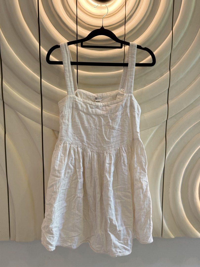 Billabong white linen sundress (Category: Dresses) located in Angeles City. Submitted by adeclutters__ (Listing ID 1468341490, Image 1). Description: - Brand: Billabong - Size: XS - Color: White - Origin: Made in India - Material: Lightweight and breathable - Design: Square neckline, thick straps, pleated bodice, and back button closure - Style: Simple, versatile, perfect for beach days, warm weather, and casual outings Bought at 2000 Selling at 
