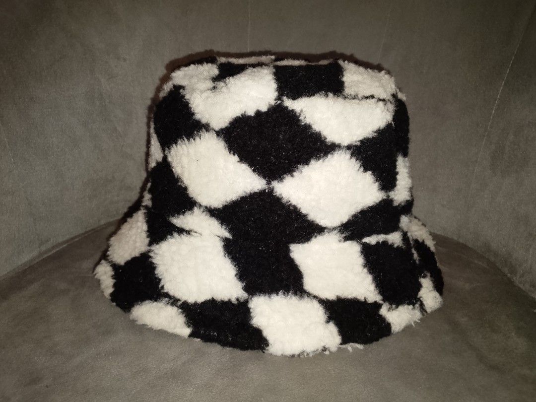 Black & White Checkered Fuzzy Bucket Hat (Category: Hats & Beanies) located in Binangonan. Submitted by yuristalin888 (Listing ID 1468287870, Image 3). Description: Add a bold touch to your casual style with this black and white checkered bucket hat. Featuring a soft, fluffy textured fabric, a classic bucket silhouette, and a comfortable black inner lining, it’s a stylish accessory for streetwear, everyday outings, and cool-weather looks..