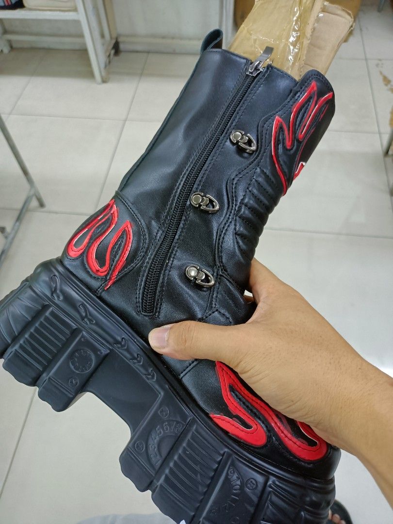 Black and Red Flame Chunky Platform Boots (Category: Boots) located in Manila. Submitted by pnjdianne25879 (Listing ID 1468489325, Image 3). Description: - Style: Gothic alternative statement boots - Design: Black with striking red flame appliques - Features: Chunky lug soles, heavy platform heels, multiple buckle straps - Convenience: Side zippers for easy entry - Condition note: Stuffed with cardboard inserts to maintain shape.
