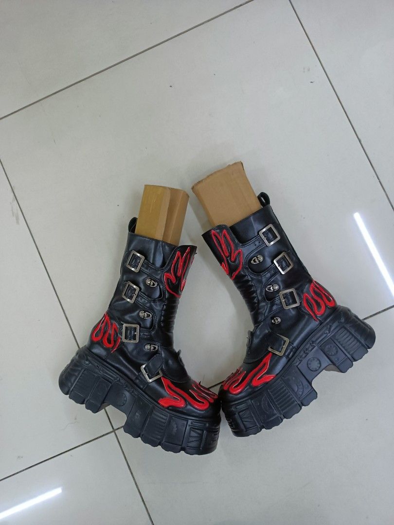 Black and Red Flame Chunky Platform Boots (Category: Boots) located in Manila. Submitted by pnjdianne25879 (Listing ID 1468489325, Image 1). Description: - Style: Gothic alternative statement boots - Design: Black with striking red flame appliques - Features: Chunky lug soles, heavy platform heels, multiple buckle straps - Convenience: Side zippers for easy entry - Condition note: Stuffed with cardboard inserts to maintain shape.