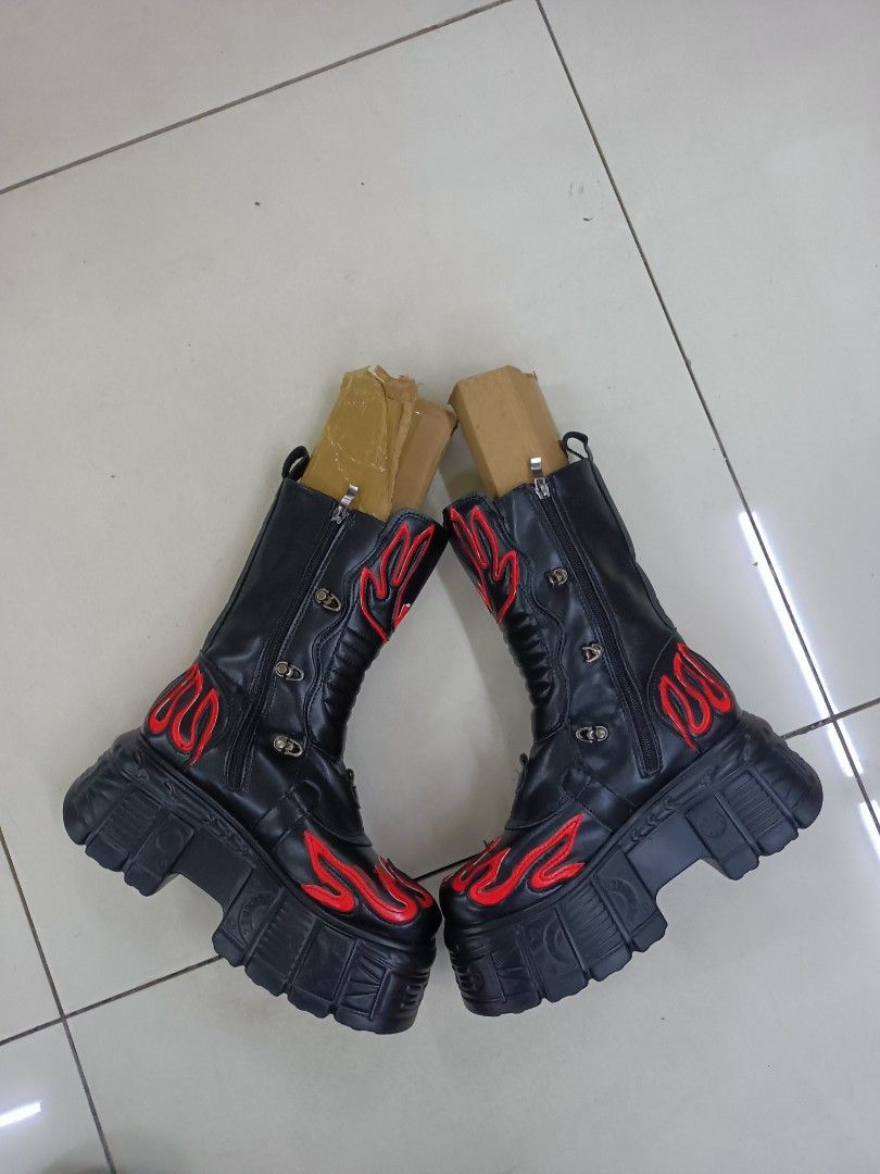 Black and Red Flame Chunky Platform Boots (Category: Boots) located in Manila. Submitted by pnjdianne25879 (Listing ID 1468489325, Image 2). Description: - Style: Gothic alternative statement boots - Design: Black with striking red flame appliques - Features: Chunky lug soles, heavy platform heels, multiple buckle straps - Convenience: Side zippers for easy entry - Condition note: Stuffed with cardboard inserts to maintain shape.