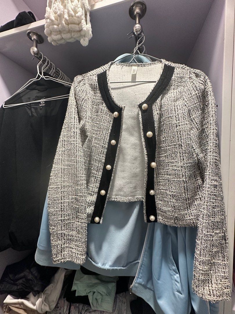 Black and White Tweed Pearl Button Jacket (Category: Coats, Jackets and Outerwear) located in Quezon City. Submitted by cuteitemsonlyyy (Listing ID 1468434169, Image 3). Description: Black and white tweed jacket with contrasting black trim along the neckline and front placket. Styled with faux pearl dome buttons down the front. Long sleeves with structured shoulders. Textured fabric. Easy to layer over blouses and tops for a dressed-up look..