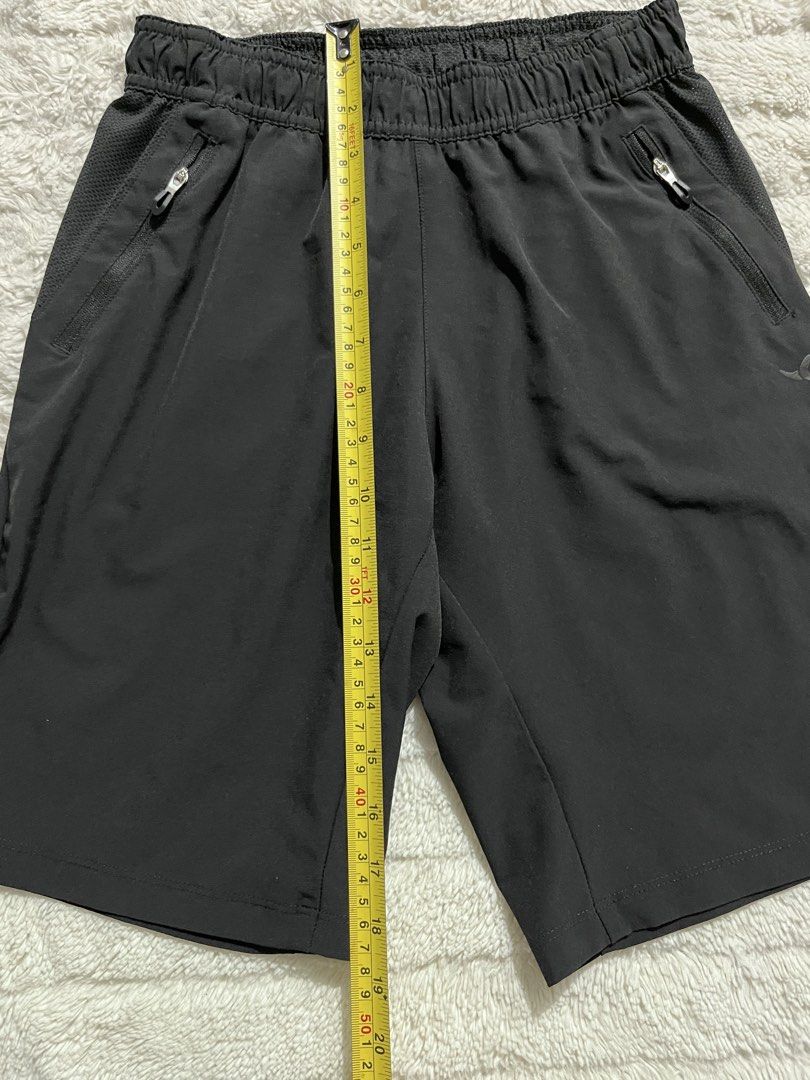 Black Athletic Shorts with Zipper Pockets (Category: Babies & Kids Fashion) located in Manila. Submitted by kiks_secret_room (Listing ID 1468381539, Image 3). Description: - Color: Black - Features: Zip pockets on both sides, breathable mesh side panels, and side slits at the hem for easy movement - Waistband: Elastic - Measurements: ~14 inches flat across (waist), ~19 inches (length) - Condition: Clean, ready to wear for workouts or running.