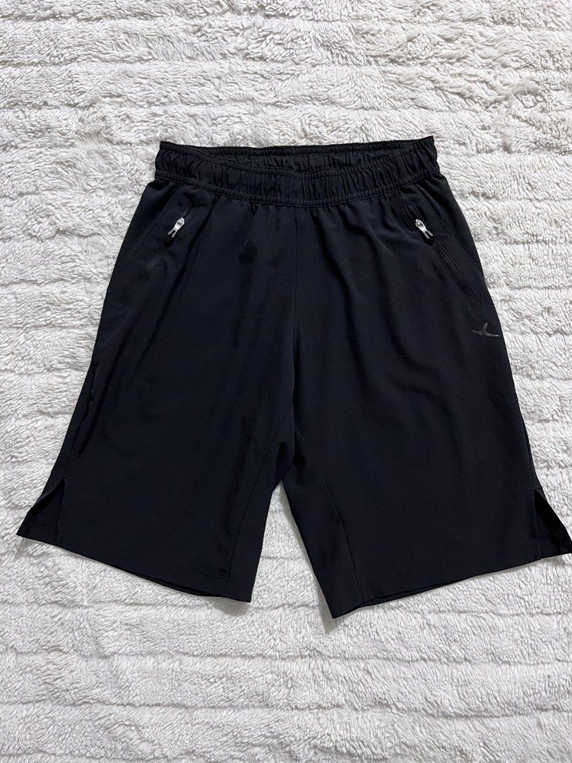 Black Athletic Shorts with Zipper Pockets (Category: Babies & Kids Fashion) located in Manila. Submitted by kiks_secret_room (Listing ID 1468381539, Image 1). Description: - Color: Black - Features: Zip pockets on both sides, breathable mesh side panels, and side slits at the hem for easy movement - Waistband: Elastic - Measurements: ~14 inches flat across (waist), ~19 inches (length) - Condition: Clean, ready to wear for workouts or running.