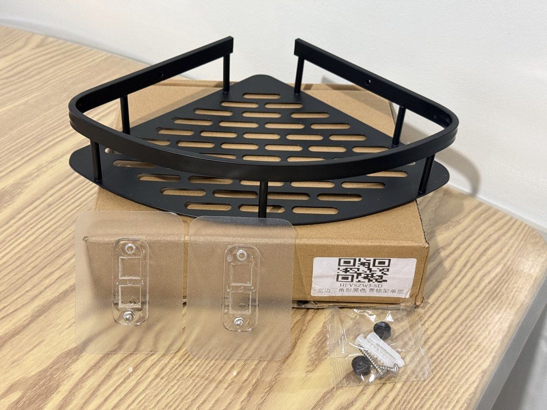 Black Bathroom Corner Storage Rack Punch-free Wall Mounted (Category: Bathroom & Kitchen Fixtures) located in Tanza. Submitted by vibrant.joy (Listing ID 1468364190, Image 1). Description: - Product: Black space aluminum triangle corner shelf - Condition: Brand new in original packaging box - Dimensions: 28cm (front edge) x 21cm (depth) x 5cm (height) - Installation: Punch-free wall mounted with adhesive stickers and screws included - Benefit: Ke