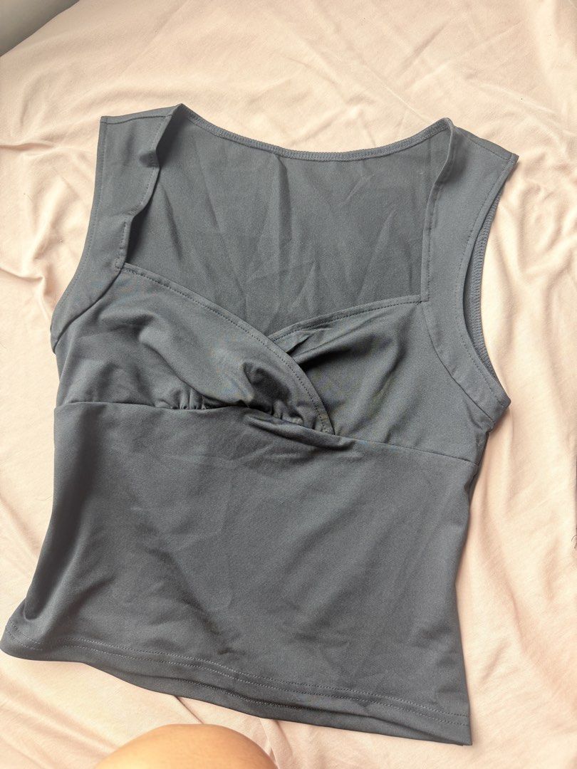 Black cross-bust sleeveless fitted top (Category: Sleeveless) located in Manila. Submitted by lucipurrpreloved (Listing ID 1468329768, Image 3). Description: Just checked if it fits, did not use. Color: Black - Style: Sleeveless top with cross-bust design and sweetheart neckline - Fit: Fitted silhouette in soft, stretchy fabric - Condition: Worn once for a quick photo, freshly washed, zero flaws - Styling: Pairs effortlessly with high-waisted jea