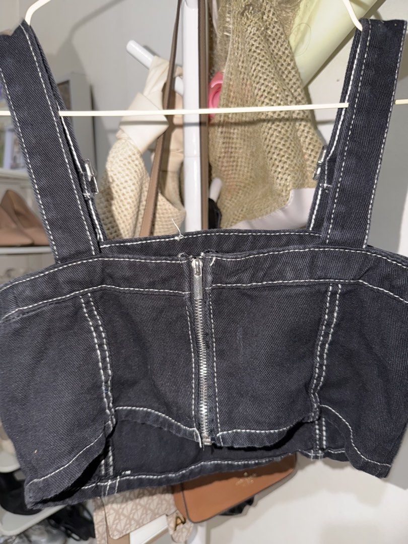Black Denim Crop Top with Contrast Stitching (Category: Sleeveless) located in Taguig. Submitted by deguzmanke83356 (Listing ID 1468333723, Image 2). Description: - Color & Material: Black structured denim with striking white contrast stitching - Hardware & Closure: Adjustable straps with metal buckles and full zipper down the back - Fit: Structured crop top that holds its shape well - Styling: Pairs effortlessly with high-waisted jeans or skirts