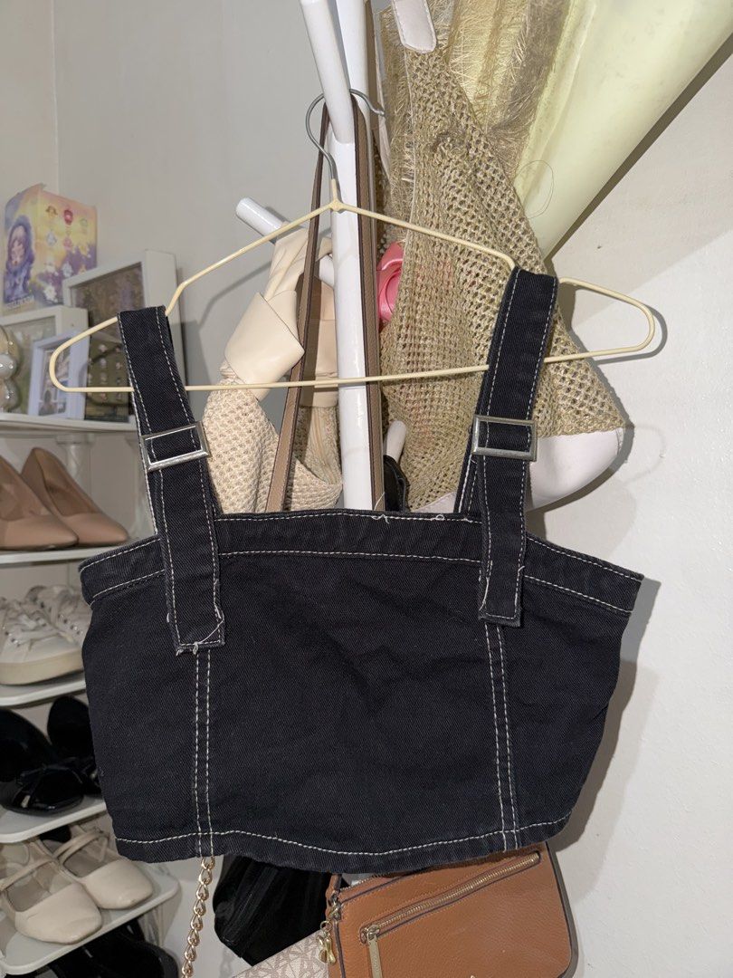 Black Denim Crop Top with Contrast Stitching (Category: Sleeveless) located in Taguig. Submitted by deguzmanke83356 (Listing ID 1468333723, Image 1). Description: - Color & Material: Black structured denim with striking white contrast stitching - Hardware & Closure: Adjustable straps with metal buckles and full zipper down the back - Fit: Structured crop top that holds its shape well - Styling: Pairs effortlessly with high-waisted jeans or skirts