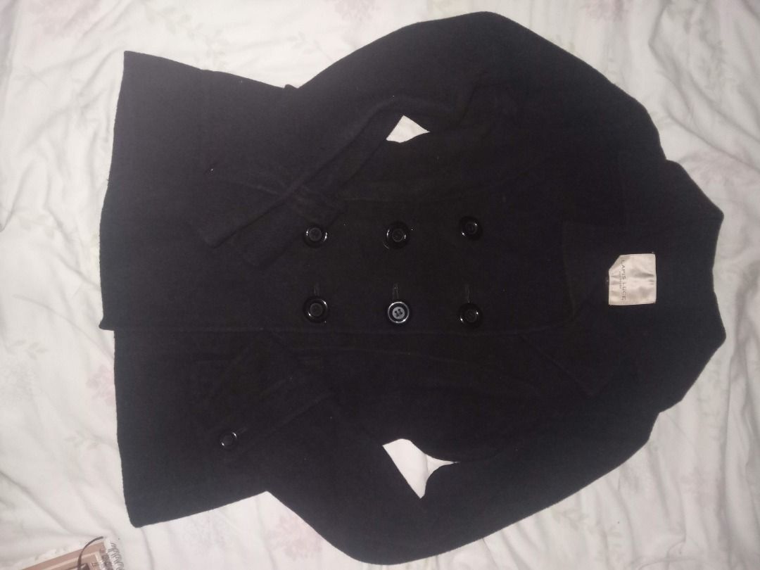 Black Double Breasted Pea Coat (Category: Coats, Jackets and Outerwear) located in La Trinidad. Submitted by roseee.a84fe6 (Listing ID 1468411681, Image 2). Description: - Color: Classic Black - Style: Double-breasted pea coat with notch lapels - Closure: Six dark front buttons - Pockets: Two front flap pockets - Details: Structured shoulders, long sleeves with button tab cuffs - Length: Mid-length cut - Fabric: Heavy textured winter fabric, idea