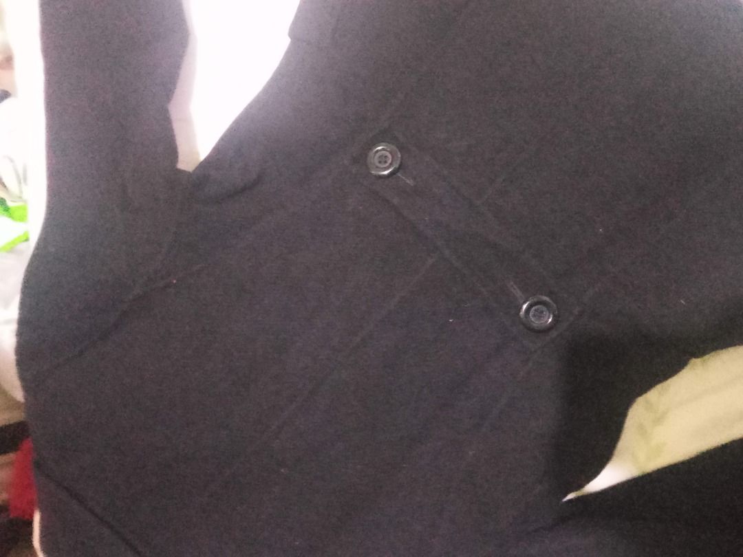 Black Double Breasted Pea Coat (Category: Coats, Jackets and Outerwear) located in La Trinidad. Submitted by roseee.a84fe6 (Listing ID 1468411681, Image 3). Description: - Color: Classic Black - Style: Double-breasted pea coat with notch lapels - Closure: Six dark front buttons - Pockets: Two front flap pockets - Details: Structured shoulders, long sleeves with button tab cuffs - Length: Mid-length cut - Fabric: Heavy textured winter fabric, idea