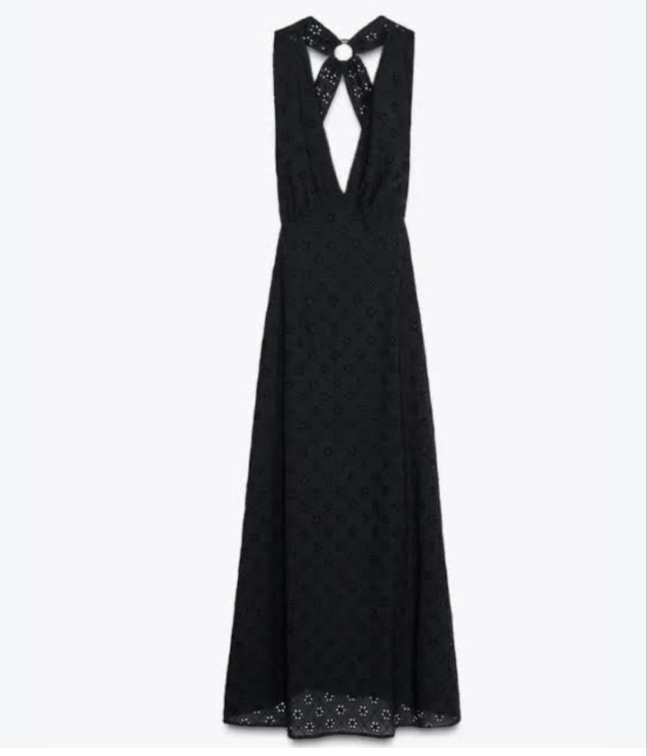 Black eyelet maxi dress with halter open back (Category: Dresses) located in Quezon City. Submitted by gwy_preloved (Listing ID 1468306399, Image 2). Description: - Style: Black eyelet maxi dress with embroidered floral pattern - Design: Deep V-neckline, open back, halter straps with ring detail, and patterned hem - Material: Lightweight and comfortable fabric - Occasion: Perfect for summer beach trips or evening outings - Fit: Full length, easy 