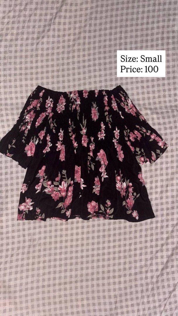 Black Floral Off-Shoulder Smocked Blouse Small (Category: Blouses) located in Quezon City. Submitted by analiza_venigas1247 (Listing ID 1468422403, Image 1). Description: - Style: Off-shoulder top with short flared sleeves - Pattern: Pink floral print on black fabric - Fit: Stretchy smocked bodice for maximum comfort - Material: Lightweight and easy to style - Size: Small .