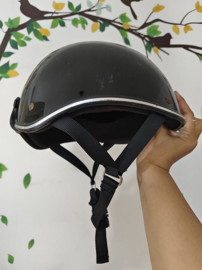 Black Half Shell Motorcycle Helmet (Category: Caps & Hats) located in Bulacan. Submitted by babz30261 (Listing ID 1468440276, Image 1). Description: - Color/Finish: Glossy black with stylish silver trim - Safety: Certified with PSC and S safety standard stickers - Fit & Comfort: Adjustable black chin strap with a convenient quick-release buckle - Condition: Some minor scuffs on the outer shell from normal use, but structurally solid - Ideal For: 