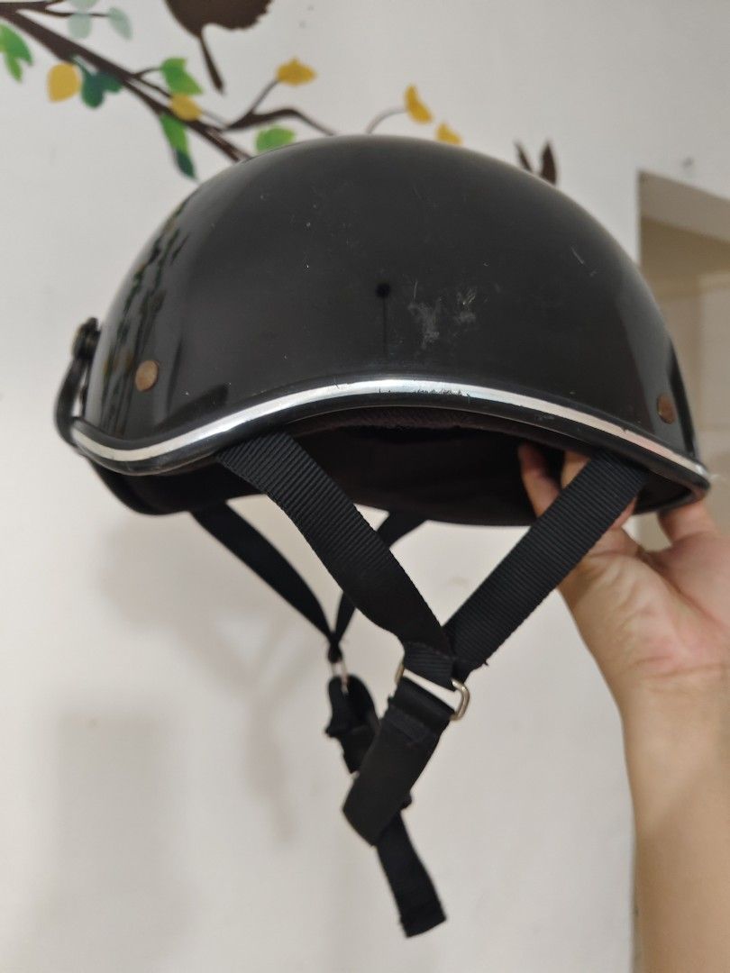 Black Half Shell Motorcycle Helmet (Category: Caps & Hats) located in Bulacan. Submitted by babz30261 (Listing ID 1468440276, Image 2). Description: - Color/Finish: Glossy black with stylish silver trim - Safety: Certified with PSC and S safety standard stickers - Fit & Comfort: Adjustable black chin strap with a convenient quick-release buckle - Condition: Some minor scuffs on the outer shell from normal use, but structurally solid - Ideal For: 