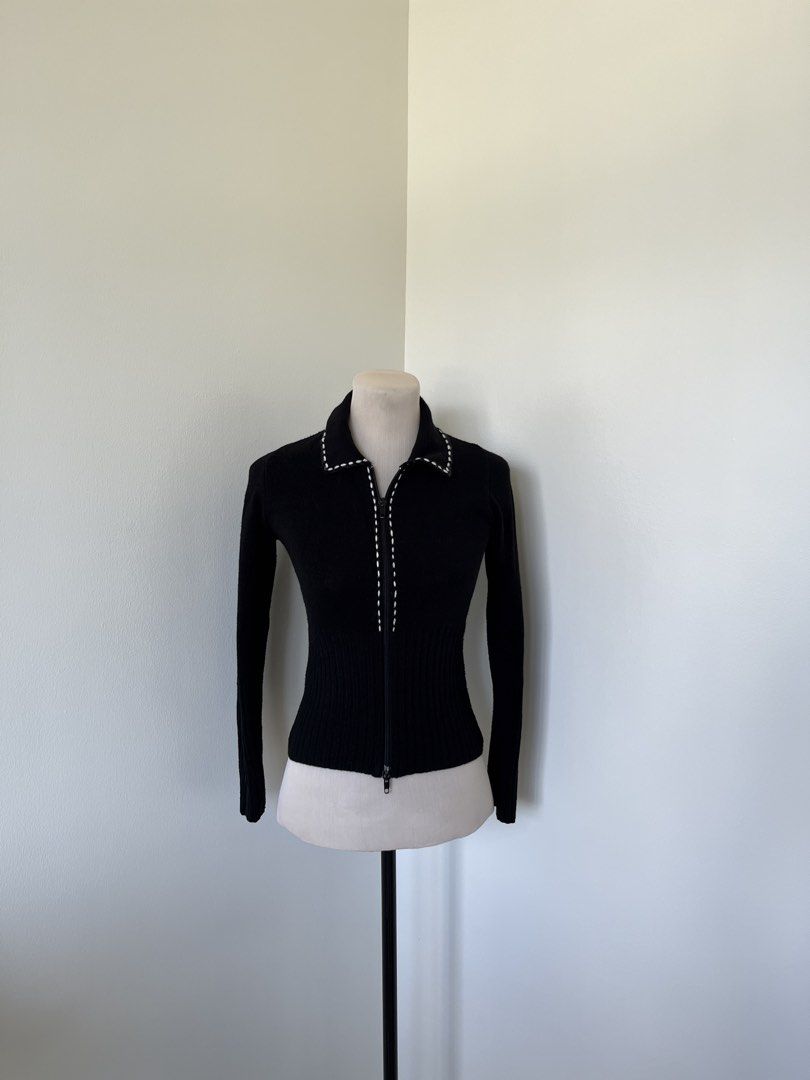 Black Knitted Zip-Up Cardigan with White Stitching (Category: Coats, Jackets and Outerwear) located in Mandaluyong City. Submitted by bravedeer.020ad7 (Listing ID 1468360146, Image 1). Description: - Color/Style: Black fitted zip-up knit cardigan with contrast white whipstitch trim - Details: Full sleeves, ribbed texture throughout, front zipper closure - Measurements (Flat): Pit to pit ~14 inches, Shoulder to hem ~18.5 inches - Condition: Great 