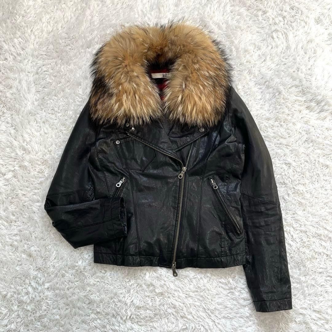 Black Leather Jacket with Fur Collar (Category: Coats, Jackets and Outerwear) located in Quezon City. Submitted by cuteitemsonlyyy (Listing ID 1468432582, Image 2). Description: - Style: Motorcycle jacket with a bold cropped fit - Details: Massive fluffy faux fur collar, asymmetric front zipper, metal snaps, and zippered pockets - Interior: Vibrant red lining - Comfort: Really warm, perfect for winter styling - Condition: Great piece to elevate a