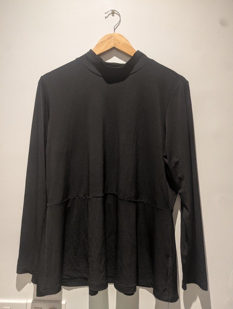 Black Long Sleeve Mock Neck Peplum Blouse (Category: Blouses) located in Quezon City. Submitted by moonjay2026 (Listing ID 1468360264, Image 1). Description: - Color: Solid Black - Size: Largee of XL - Style: Long sleeves, mock neckline, and flared peplum waist - Fit: Fitted upper body with a flattering flare - Material: Smooth and stretchy fabric for all-day comfort - Versatility: Great basic piece for work, casual outings, pants, or skirts.