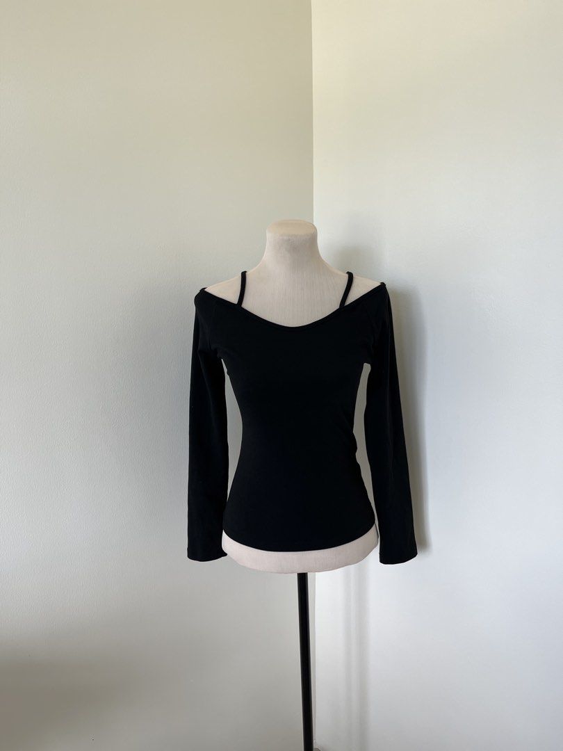 Black Long Sleeve Off Shoulder Top with Spaghetti Straps (Category: Longsleeves) located in Mandaluyong City. Submitted by bravedeer.020ad7 (Listing ID 1468362501, Image 1). Description: - Style: Off-shoulder long sleeve top with thin spaghetti straps - Fit: Fitted silhouette with soft, stretchy ribbed fabric - Color: Versatile solid black - Measurements: 23 inches length, 14 inches chest (flat) - Perfect for: Casual night outs, easily paired wit