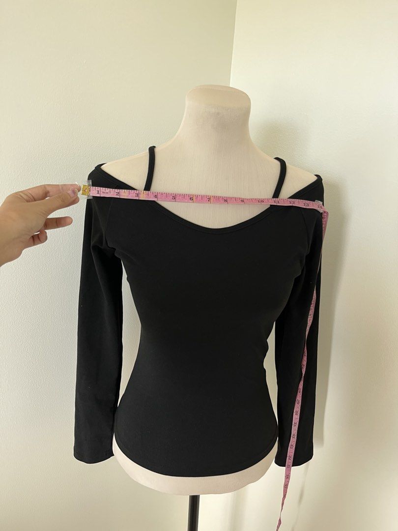 Black Long Sleeve Off Shoulder Top with Spaghetti Straps (Category: Longsleeves) located in Mandaluyong City. Submitted by bravedeer.020ad7 (Listing ID 1468362501, Image 3). Description: - Style: Off-shoulder long sleeve top with thin spaghetti straps - Fit: Fitted silhouette with soft, stretchy ribbed fabric - Color: Versatile solid black - Measurements: 23 inches length, 14 inches chest (flat) - Perfect for: Casual night outs, easily paired wit