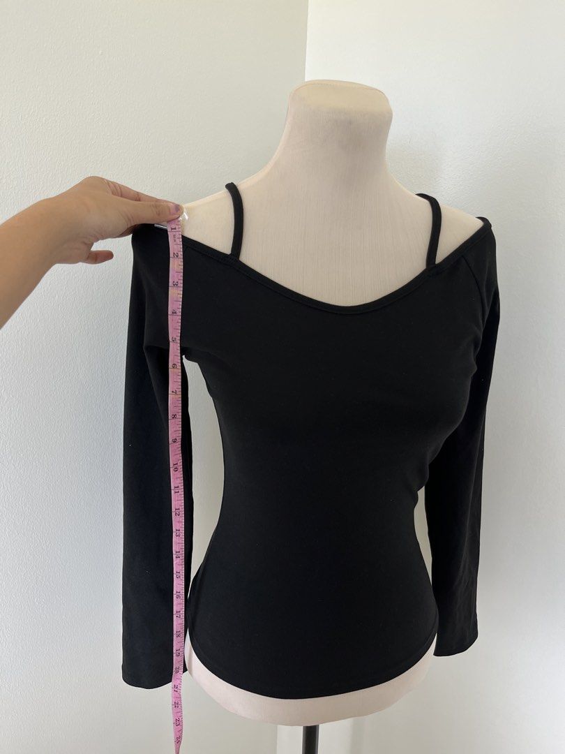Black Long Sleeve Off Shoulder Top with Spaghetti Straps (Category: Longsleeves) located in Mandaluyong City. Submitted by bravedeer.020ad7 (Listing ID 1468362501, Image 2). Description: - Style: Off-shoulder long sleeve top with thin spaghetti straps - Fit: Fitted silhouette with soft, stretchy ribbed fabric - Color: Versatile solid black - Measurements: 23 inches length, 14 inches chest (flat) - Perfect for: Casual night outs, easily paired wit
